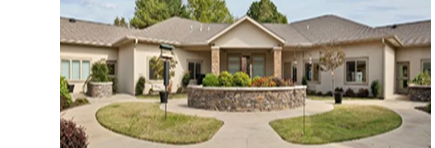 A large house with a circular driveway and a circular garden. AI generated content